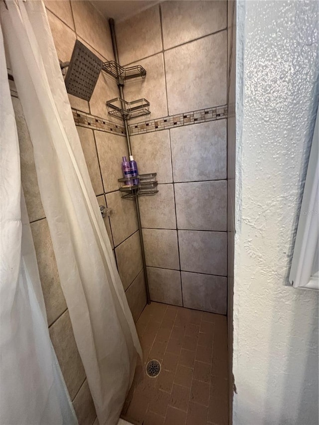 bathroom with a stall shower