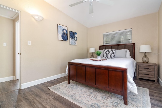 bedroom with vaulted ceiling, wood finished floors, baseboards, and ceiling fan