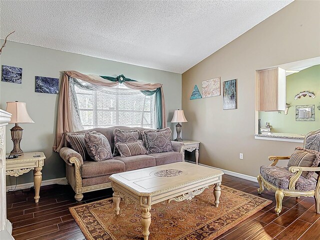 living area featuring baseboards, a textured ceiling, wood tiled floor, and vaulted ceiling