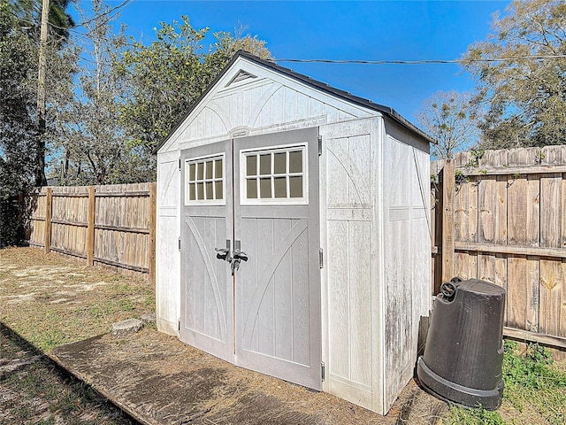 view of shed with a fenced backyard