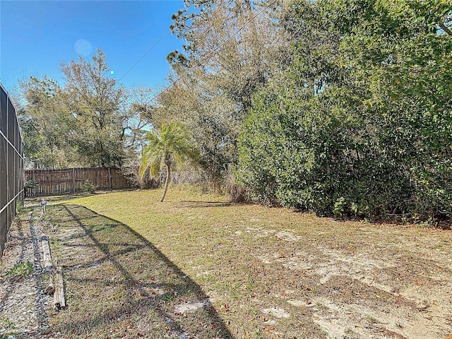 view of yard with a fenced backyard