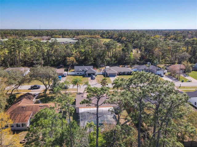 aerial view featuring a wooded view