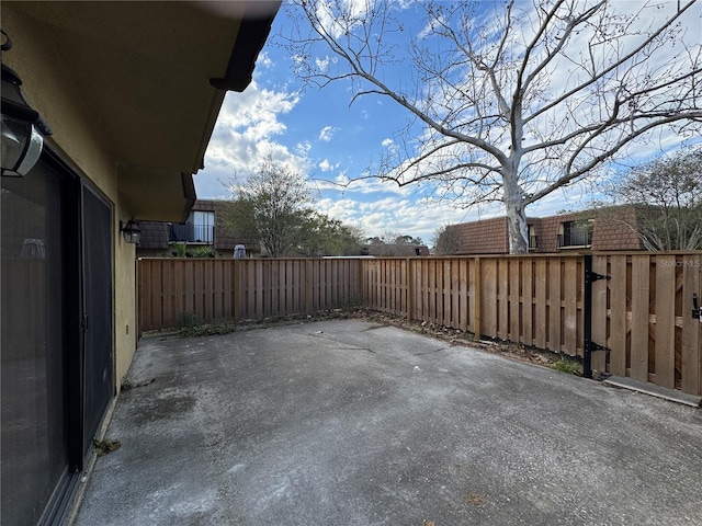 view of patio / terrace featuring fence