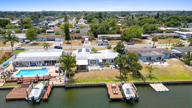 drone / aerial view featuring a residential view and a water view