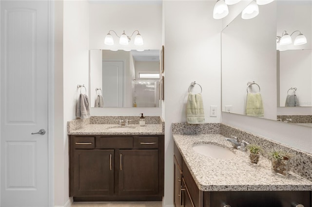 bathroom with two vanities and a sink