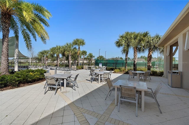 view of patio / terrace with outdoor dining area and fence