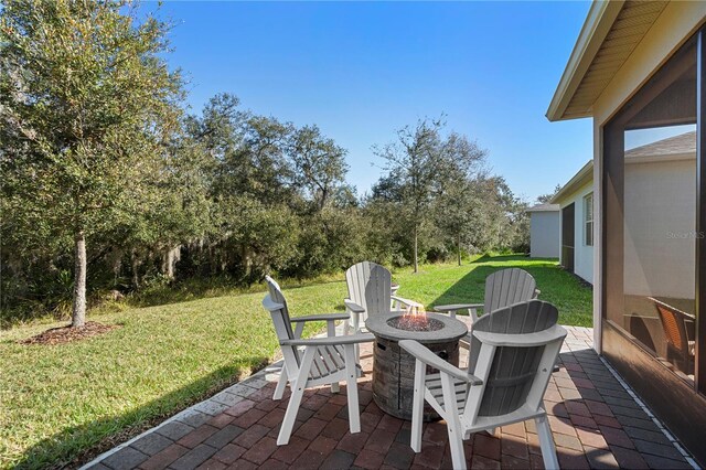 view of patio / terrace with a fire pit