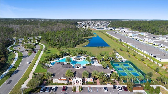 bird's eye view with a forest view and a water view