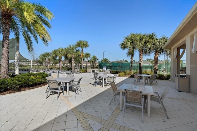 view of patio / terrace with outdoor dining area and fence