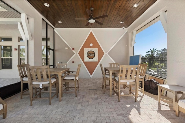 dining space with recessed lighting, wood ceiling, brick floor, and ceiling fan