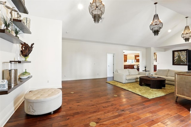 living area featuring a chandelier, baseboards, visible vents, and hardwood / wood-style floors