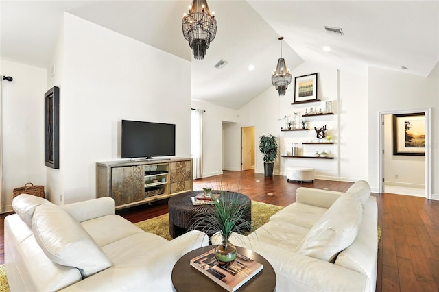 living area featuring an inviting chandelier, visible vents, and hardwood / wood-style flooring