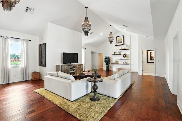 living area featuring visible vents, dark wood finished floors, baseboards, and an inviting chandelier