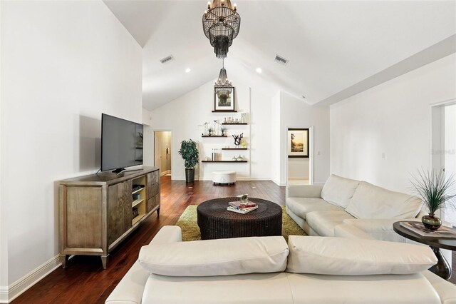 living room with a chandelier, dark wood-type flooring, and visible vents