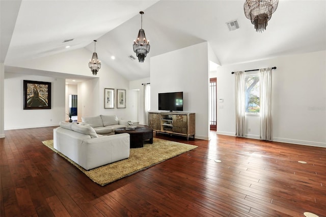 living room featuring dark wood finished floors, visible vents, a notable chandelier, and baseboards