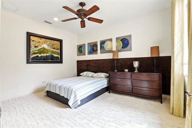 bedroom with ceiling fan, recessed lighting, light colored carpet, visible vents, and baseboards