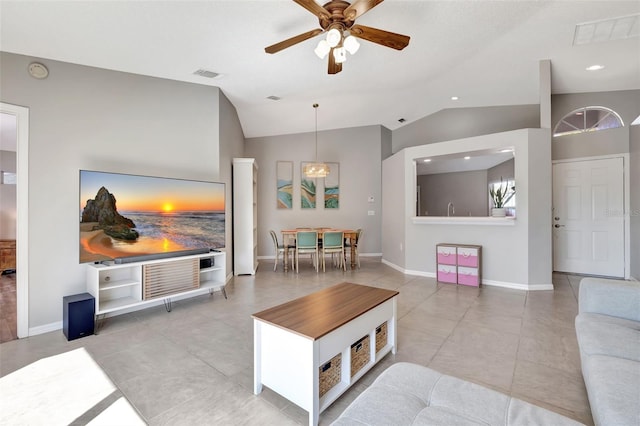 living area featuring lofted ceiling, baseboards, visible vents, and tile patterned floors