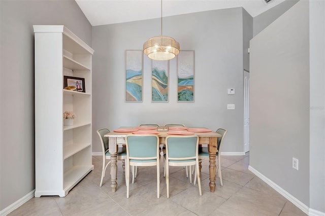 dining space featuring tile patterned floors and baseboards