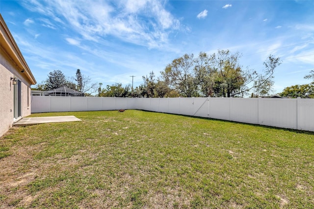 view of yard with a fenced backyard and a patio area