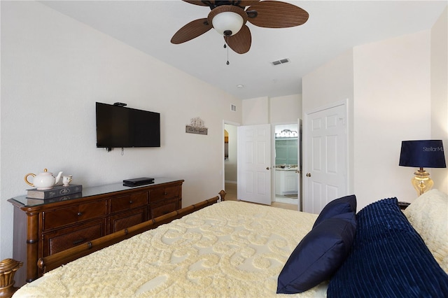 bedroom featuring visible vents, ensuite bath, baseboards, and a ceiling fan