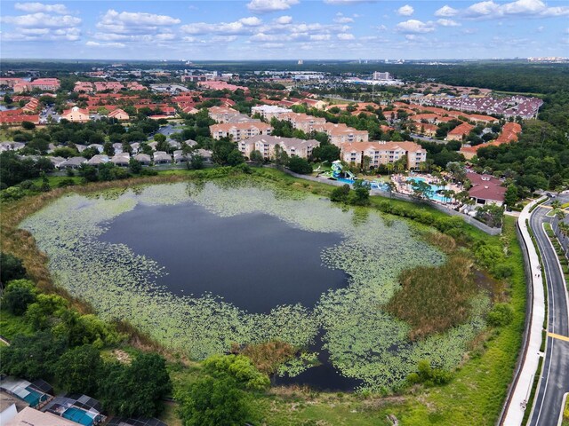 drone / aerial view featuring a water view and a residential view