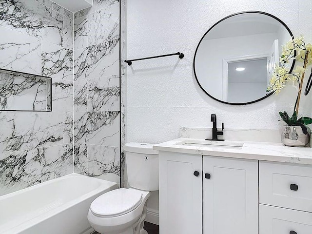 bathroom with toilet and vanity