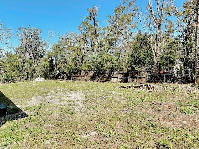 view of yard featuring fence