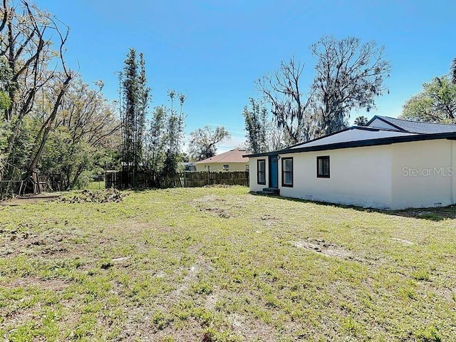 view of yard with fence