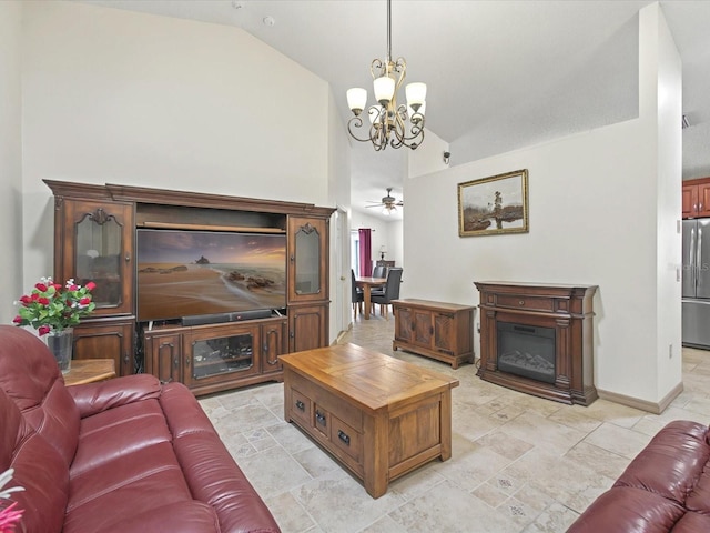 living room with a chandelier, lofted ceiling, baseboards, and a glass covered fireplace