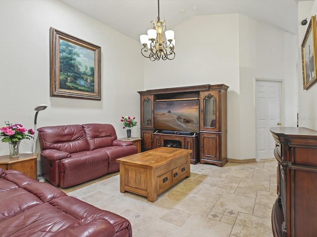 living room with an inviting chandelier, stone finish floor, baseboards, and high vaulted ceiling