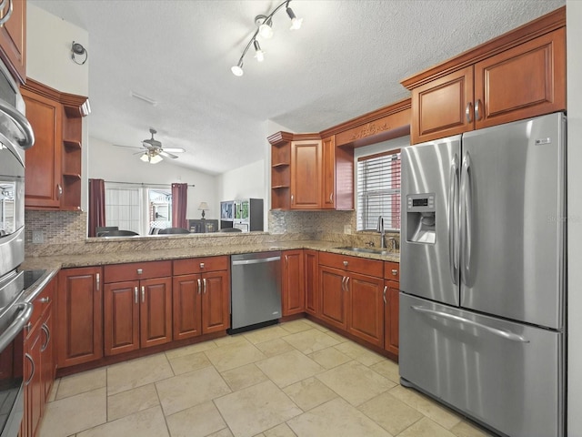 kitchen featuring a sink, open shelves, vaulted ceiling, and stainless steel appliances