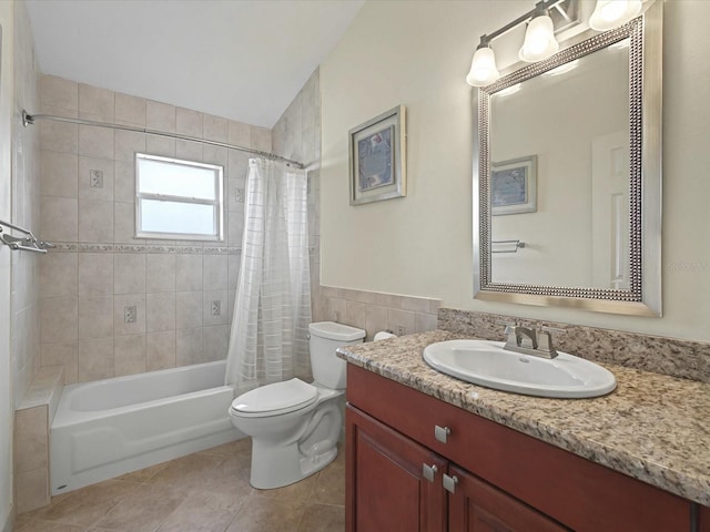 full bathroom with vanity, tile patterned flooring, tile walls, toilet, and shower / tub combo with curtain