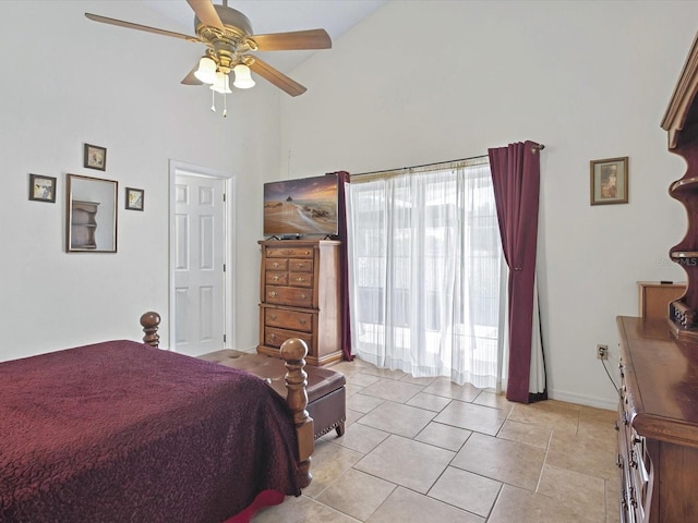 bedroom with light tile patterned flooring, baseboards, a towering ceiling, and ceiling fan