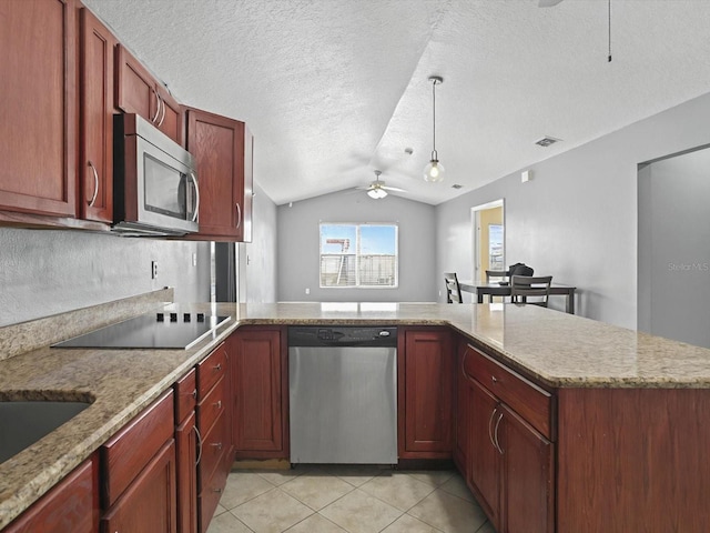 kitchen with a ceiling fan, appliances with stainless steel finishes, a peninsula, light tile patterned floors, and lofted ceiling