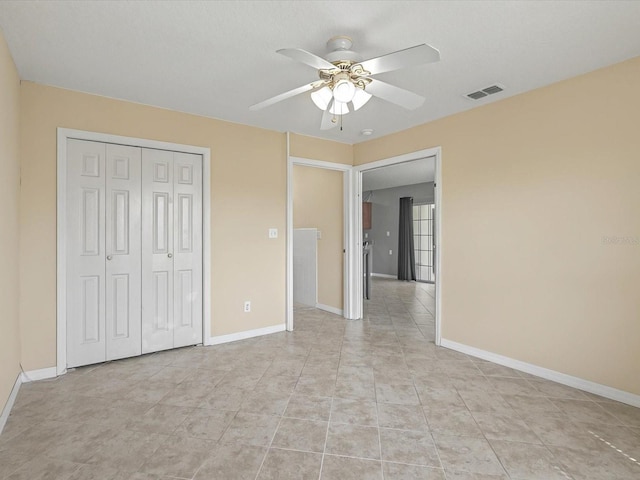 unfurnished bedroom with visible vents, baseboards, a closet, and ceiling fan