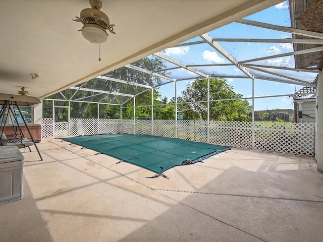 view of swimming pool with a lanai, a fenced in pool, a patio, and fence