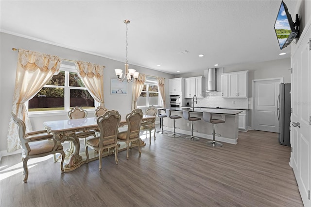 dining room with visible vents, baseboards, dark wood finished floors, an inviting chandelier, and recessed lighting