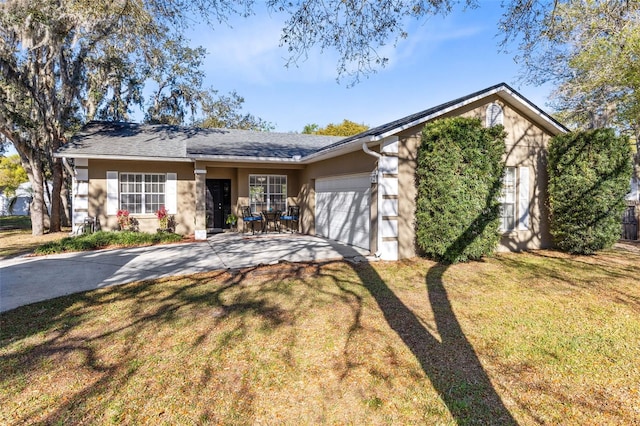 single story home with stucco siding, driveway, a front yard, and an attached garage