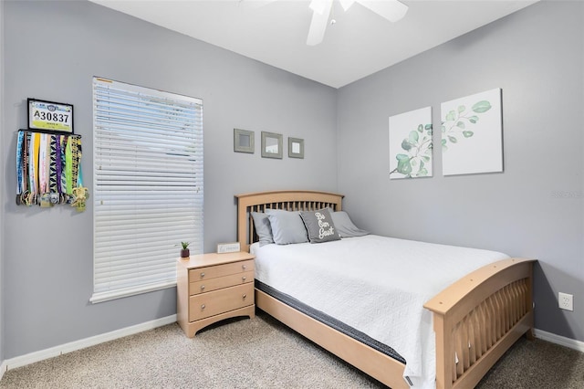 bedroom featuring ceiling fan, baseboards, and light carpet