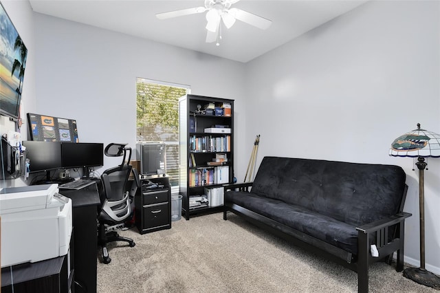 office area with a ceiling fan and carpet floors