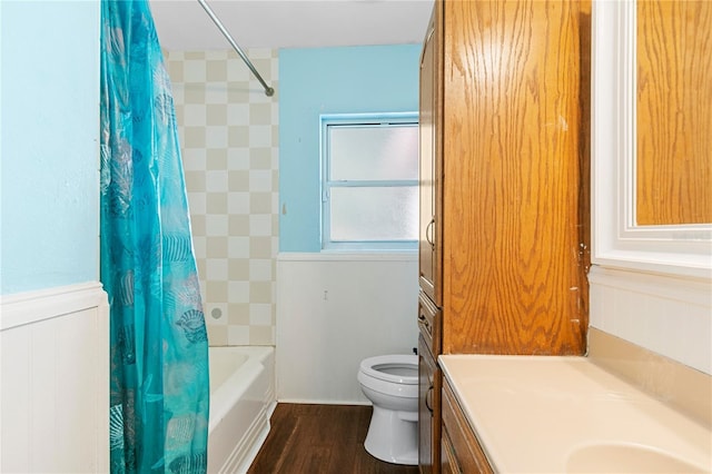 full bath with wood finished floors, toilet, shower / tub combo with curtain, and vanity