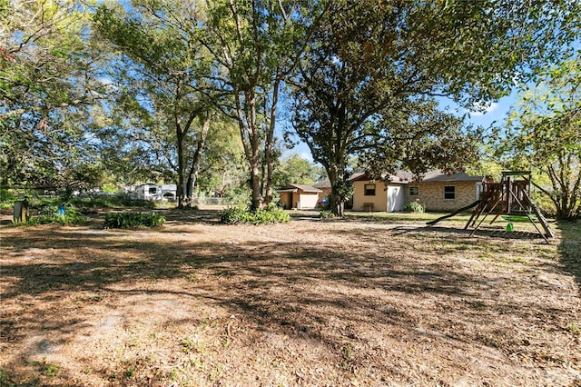 view of yard with a playground