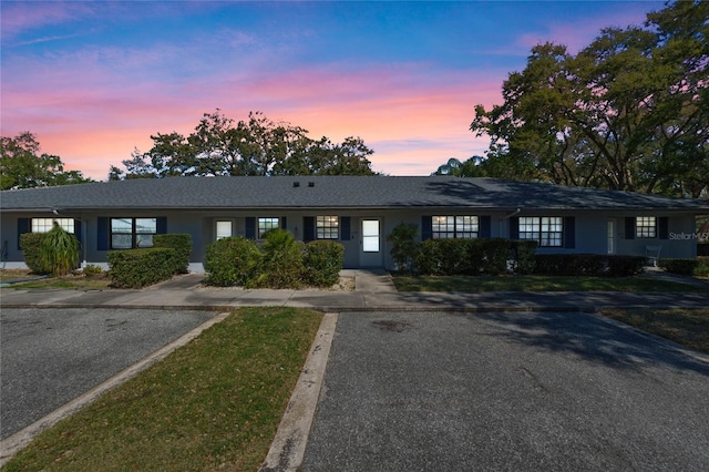 ranch-style house with stucco siding