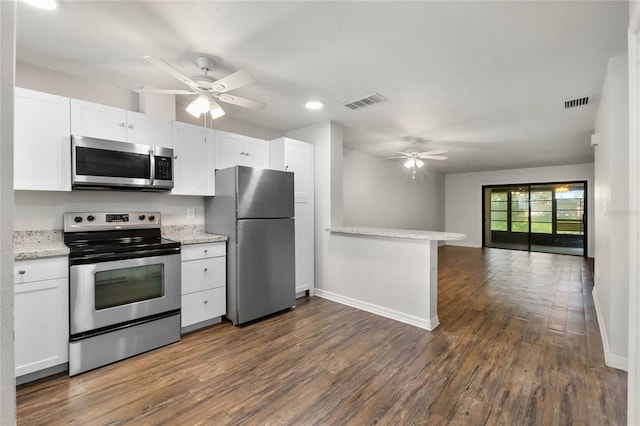 kitchen featuring visible vents, ceiling fan, open floor plan, appliances with stainless steel finishes, and white cabinetry