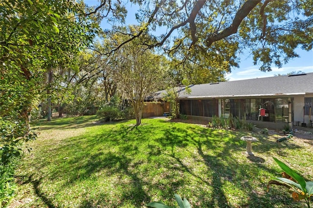 view of yard with a sunroom