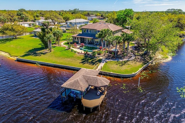 birds eye view of property with a water view