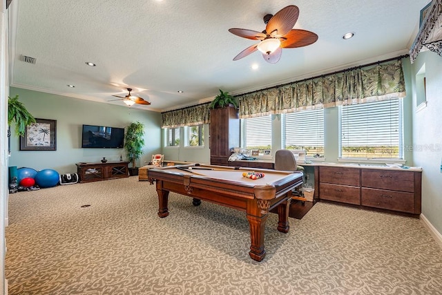 game room with a ceiling fan, baseboards, visible vents, a textured ceiling, and crown molding