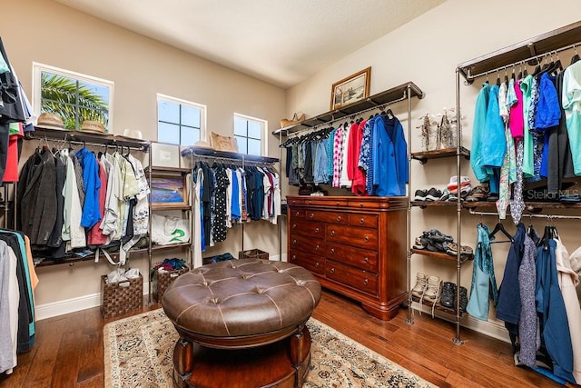 walk in closet with hardwood / wood-style floors