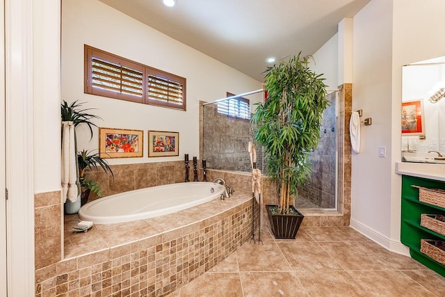 bathroom featuring vanity, recessed lighting, a shower stall, a garden tub, and tile patterned floors