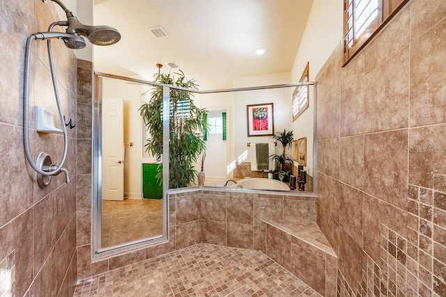 full bath featuring visible vents and a stall shower